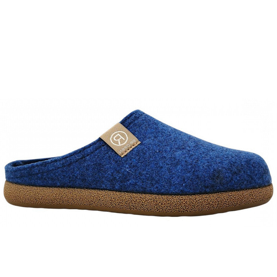 cobalt blue felt clog with a closed toe, open heel, tan logo tab, and textured brown sole, shown from the side.