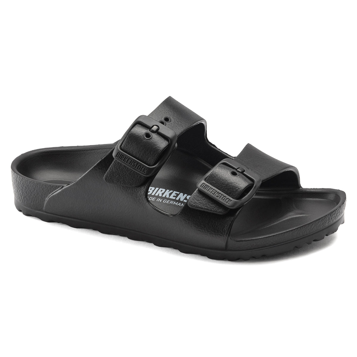 Black rubber sandal with two straps and buckle on each strap on a white background