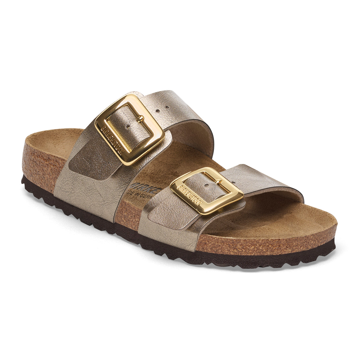 Birkenstock Arizona Big Buckle sandal in metallic champagne with a classic open-toe, slip-on silhouette. Features two wide, adjustable metallic leather straps with a textured, shimmery finish, oversized polished gold-tone rectangular buckles, a tan suede-lined contoured footbed, natural cork midsole, and dark brown ridged EVA outsole. Shown from an angled side view on a white background.