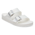 White sandal with two buckles on a white background
