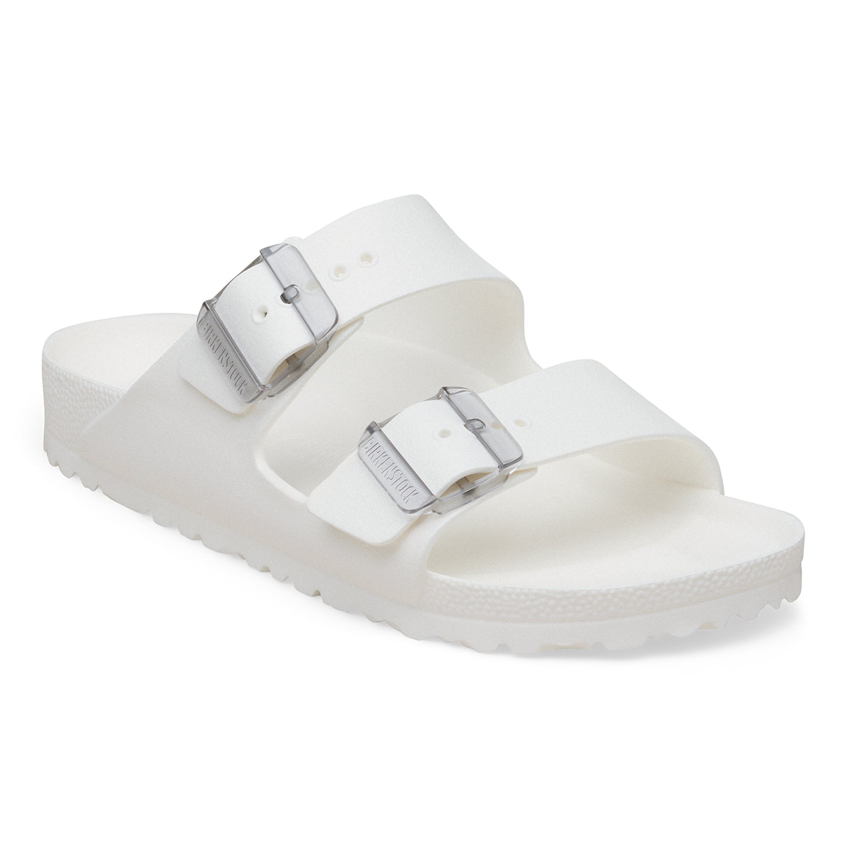 White sandal with two buckles on a white background