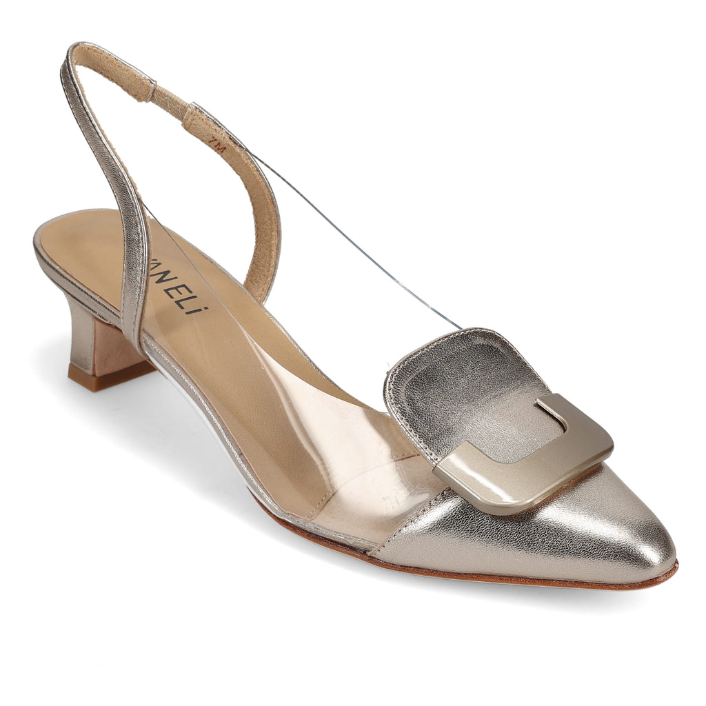 Metallic silver slingback shoe with a low block heel, pointed toe, and large square buckle accent on the front. The shoe features a transparent vinyl side panel and tan insole, combining modern and classic design elements.